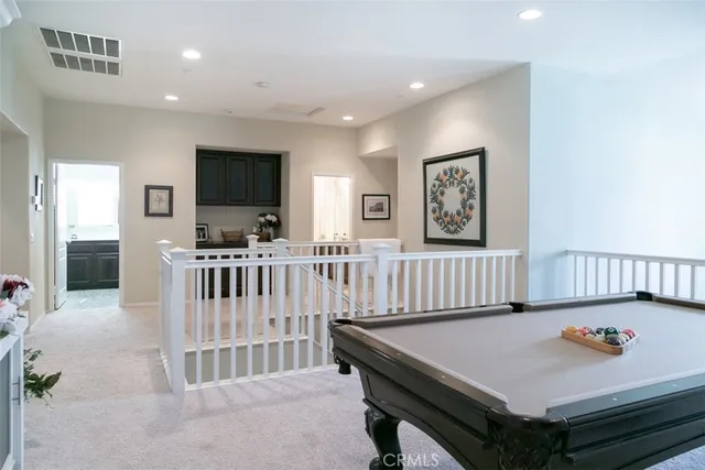 a living room with a large window and a flat screen tv