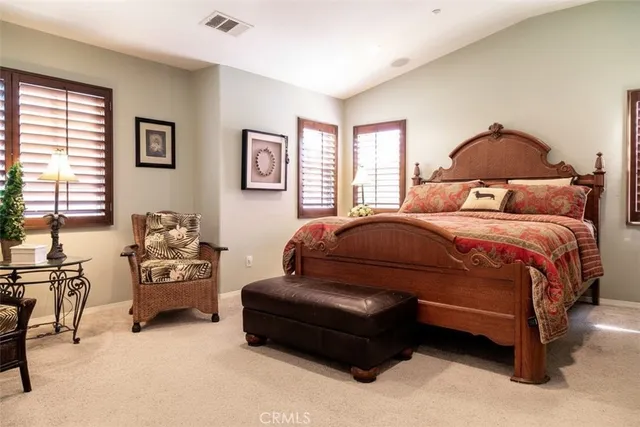 a bedroom with a bed and a couch