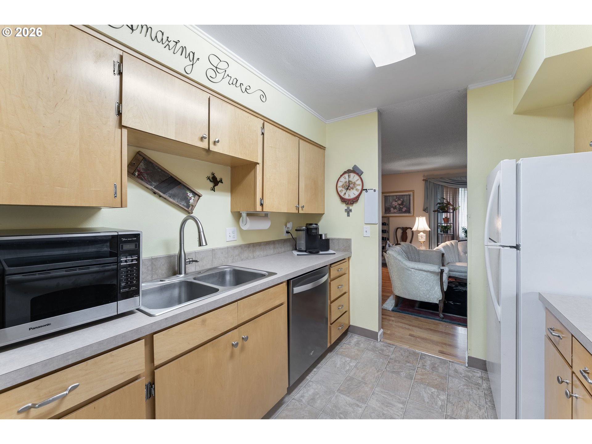11341 Southwest Springwood Drive Portland, OR 97223 - Photo 13 of 26 a kitchen with stainless steel appliances granite countertop a sink a stove and a refrigerator