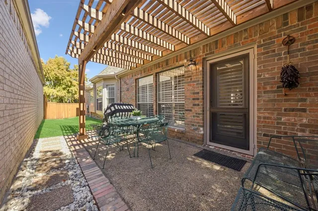 a patio with table and chairs