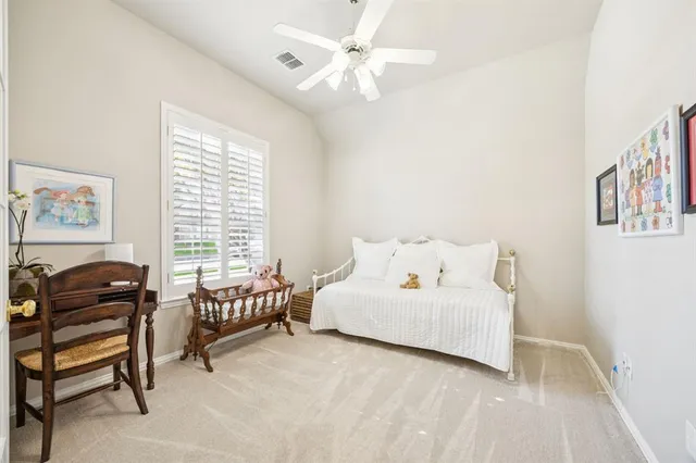 a bedroom with a bed and a couch