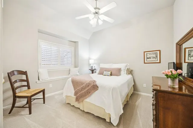 a bedroom with a bed and a chair