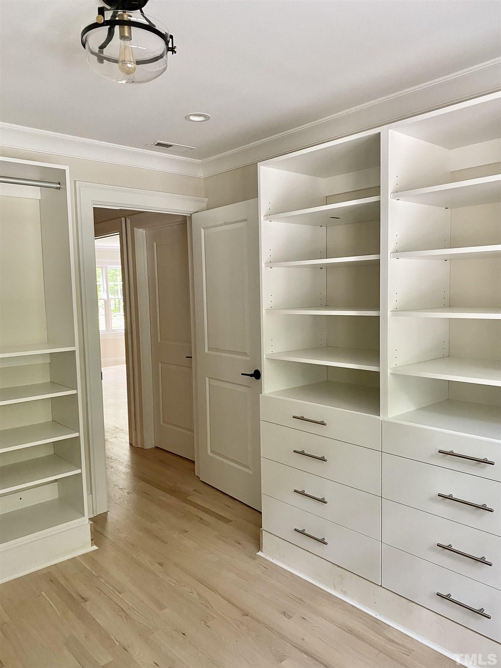 3806 Regent Road Durham, NC 27707 - Photo 11 of 21 a view of walk in closet with empty racks