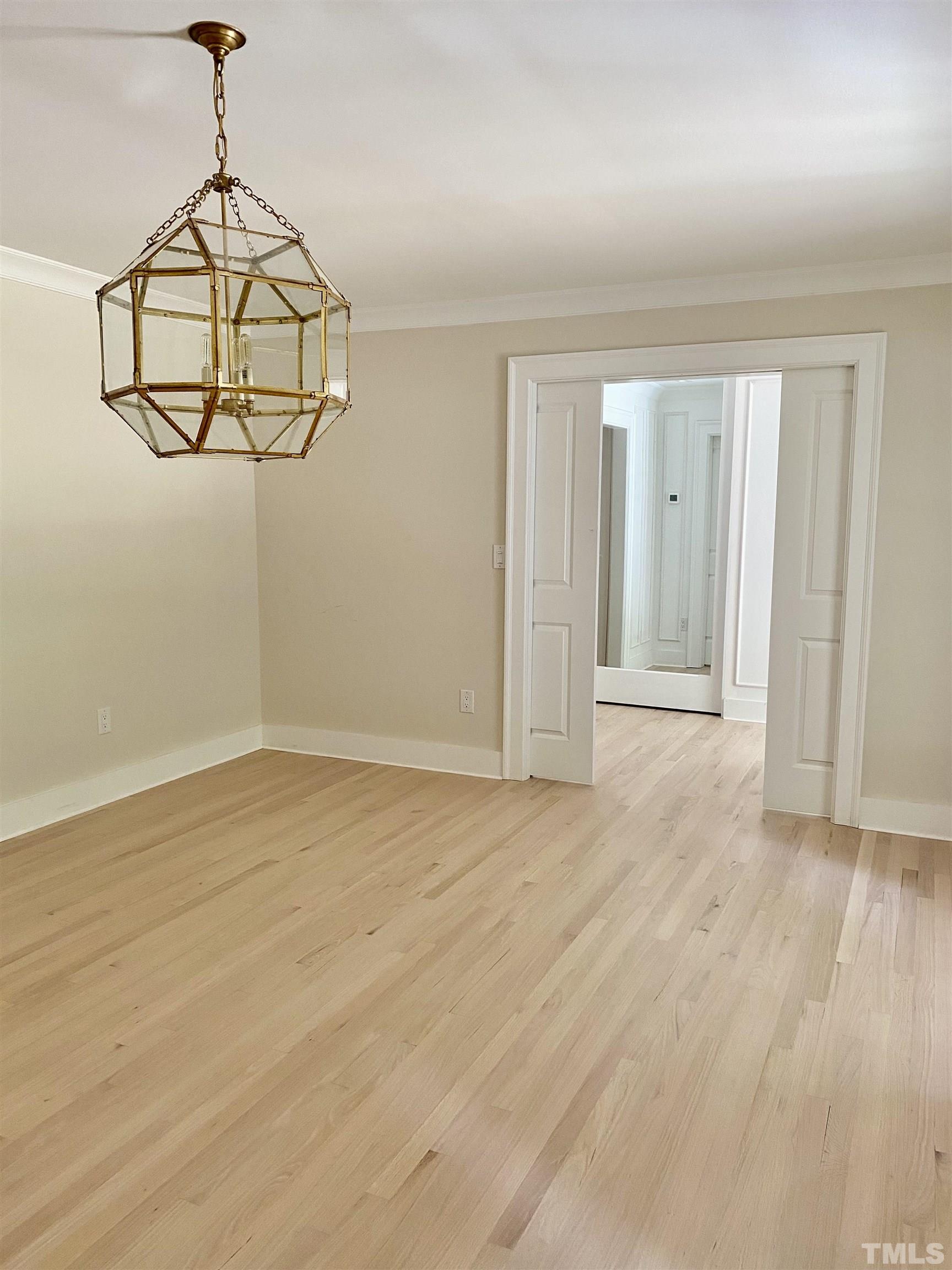 3806 Regent Road Durham, NC 27707 - Photo 7 of 21 an empty room with wooden floor and windows