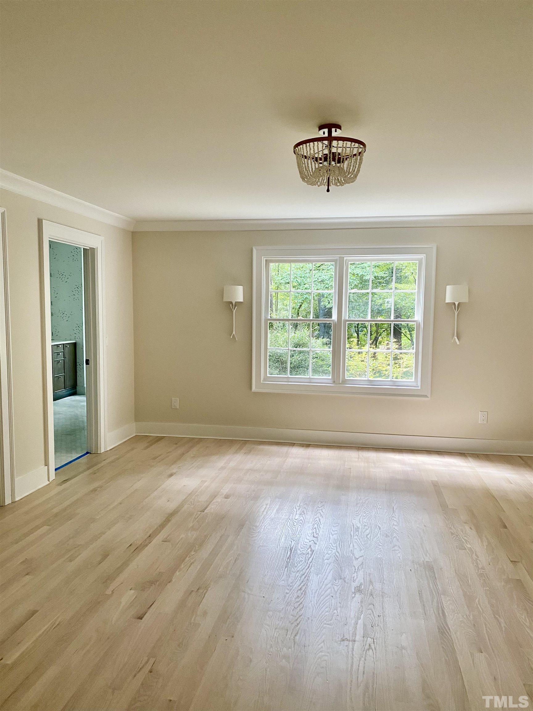 3806 Regent Road Durham, NC 27707 - Photo 9 of 21 wooden floor in an empty room with a window