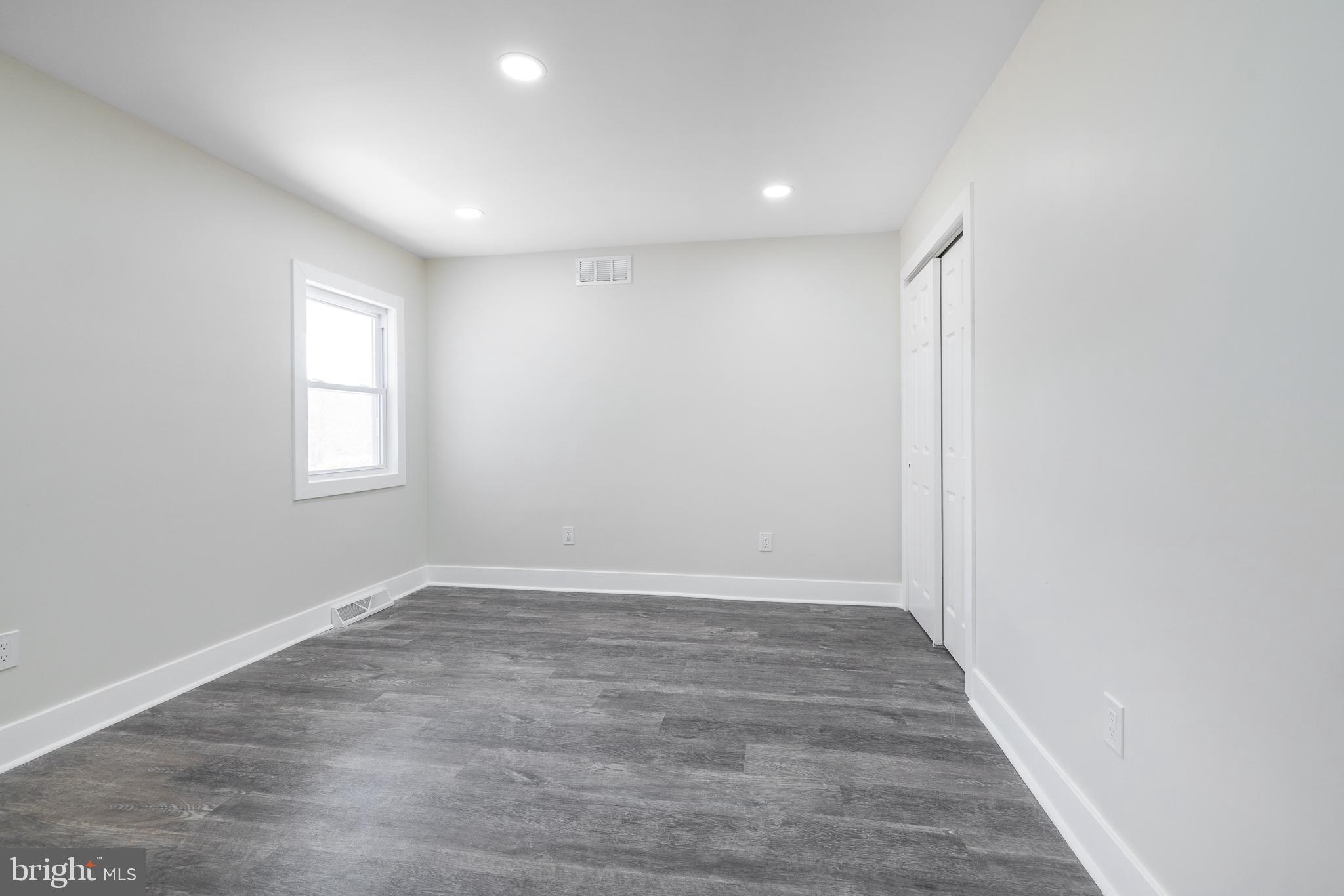 63 Childs Road Elkton, MD 21921 - Photo 13 of 44 an empty room with wooden floor and window