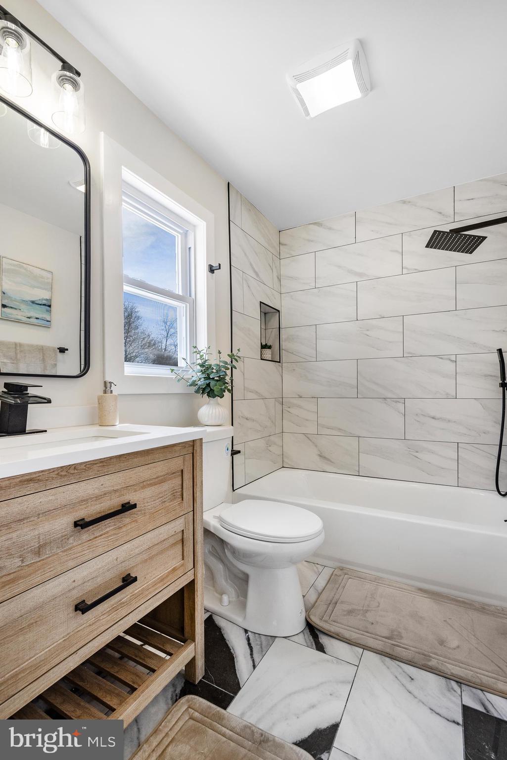 63 Childs Road Elkton, MD 21921 - Photo 19 of 44 a bathroom with a sink toilet a mirror and shower