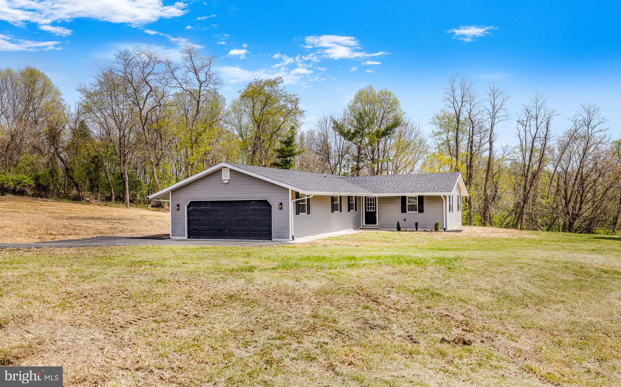 63 Childs Road Elkton, MD 21921 - Photo 2 of 44 a big house with a big yard and large trees