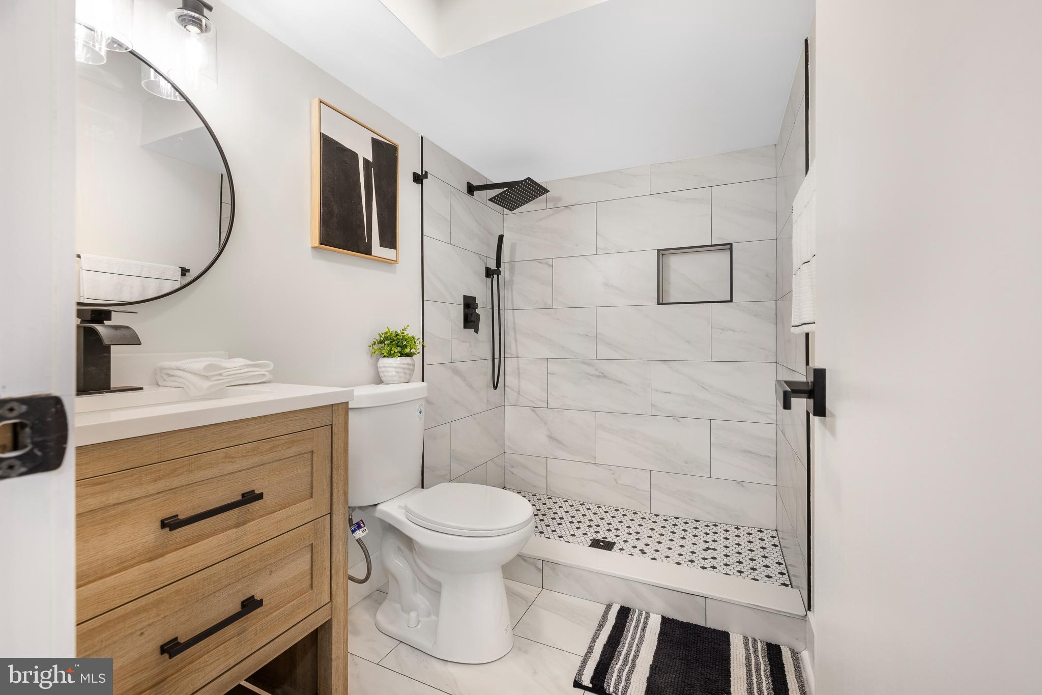 63 Childs Road Elkton, MD 21921 - Photo 27 of 44 a bathroom with a toilet a sink and mirror