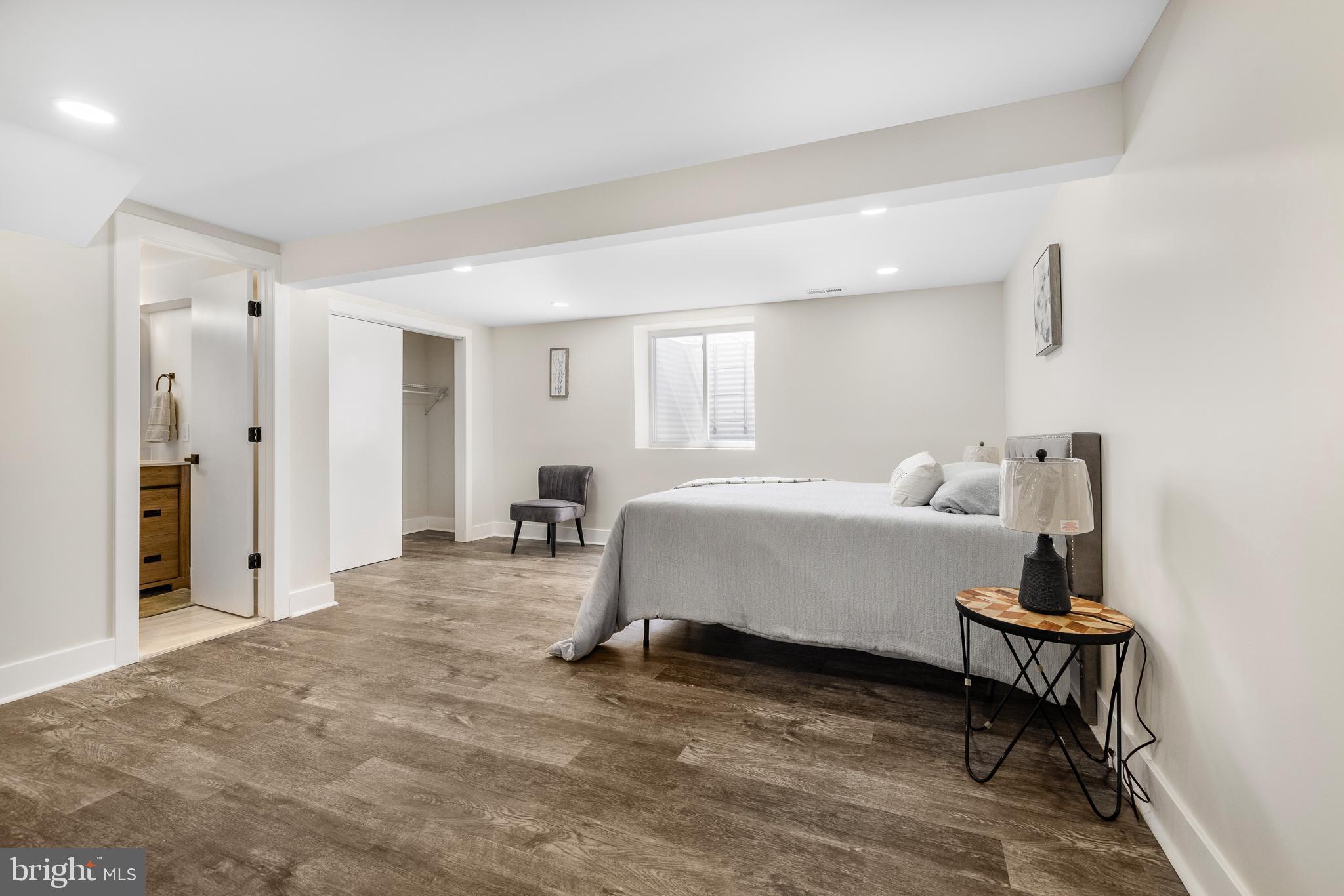 63 Childs Road Elkton, MD 21921 - Photo 30 of 44 a spacious bedroom with a bed and a table in it