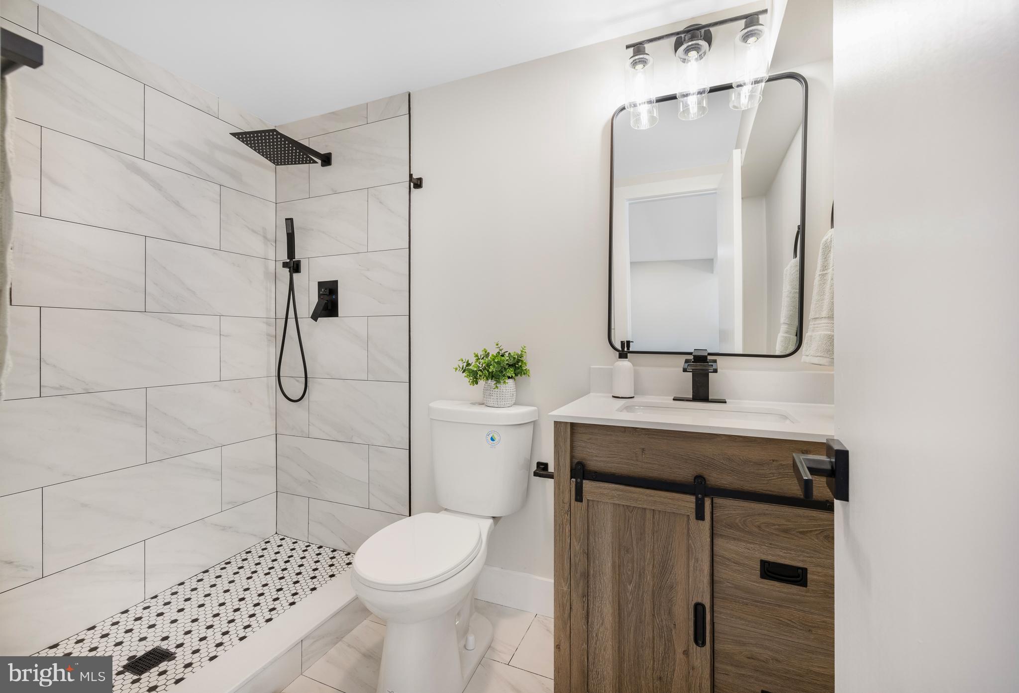 63 Childs Road Elkton, MD 21921 - Photo 32 of 44 a bathroom with a sink toilet and shower