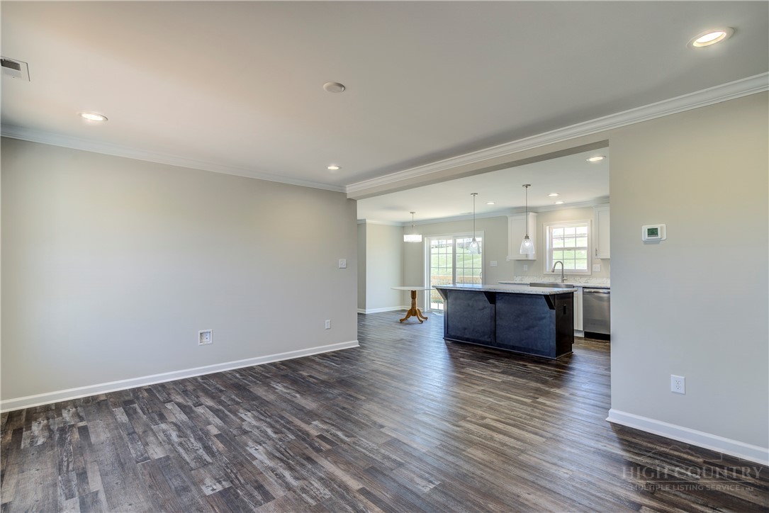 1052 Halsey Knob Road Sparta, NC 28675 - Photo 12 of 28 a view of room with window and wooden floor