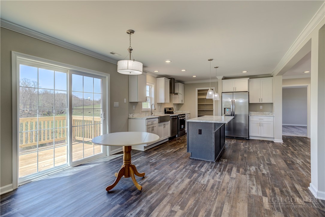 1052 Halsey Knob Road Sparta, NC 28675 - Photo 18 of 28 a living room with furniture and a wooden floor