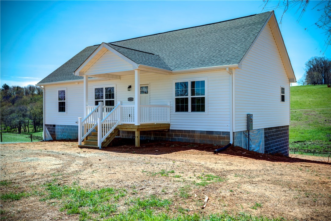 1052 Halsey Knob Road Sparta, NC 28675 - Photo 2 of 28 a front view of a house with a yard