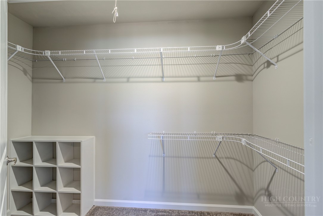 1052 Halsey Knob Road Sparta, NC 28675 - Photo 21 of 28 a view of a room with racks on the wall