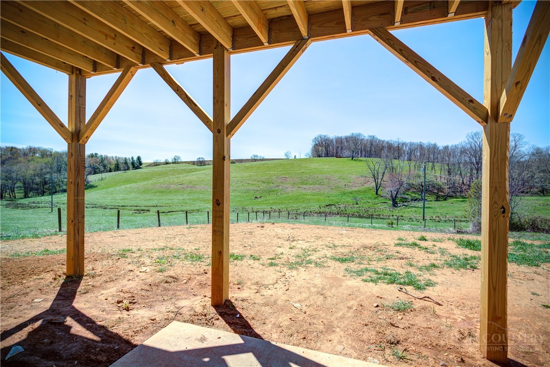 1052 Halsey Knob Road Sparta, NC 28675 - Photo 26 of 28 a view of a porch with a backyard