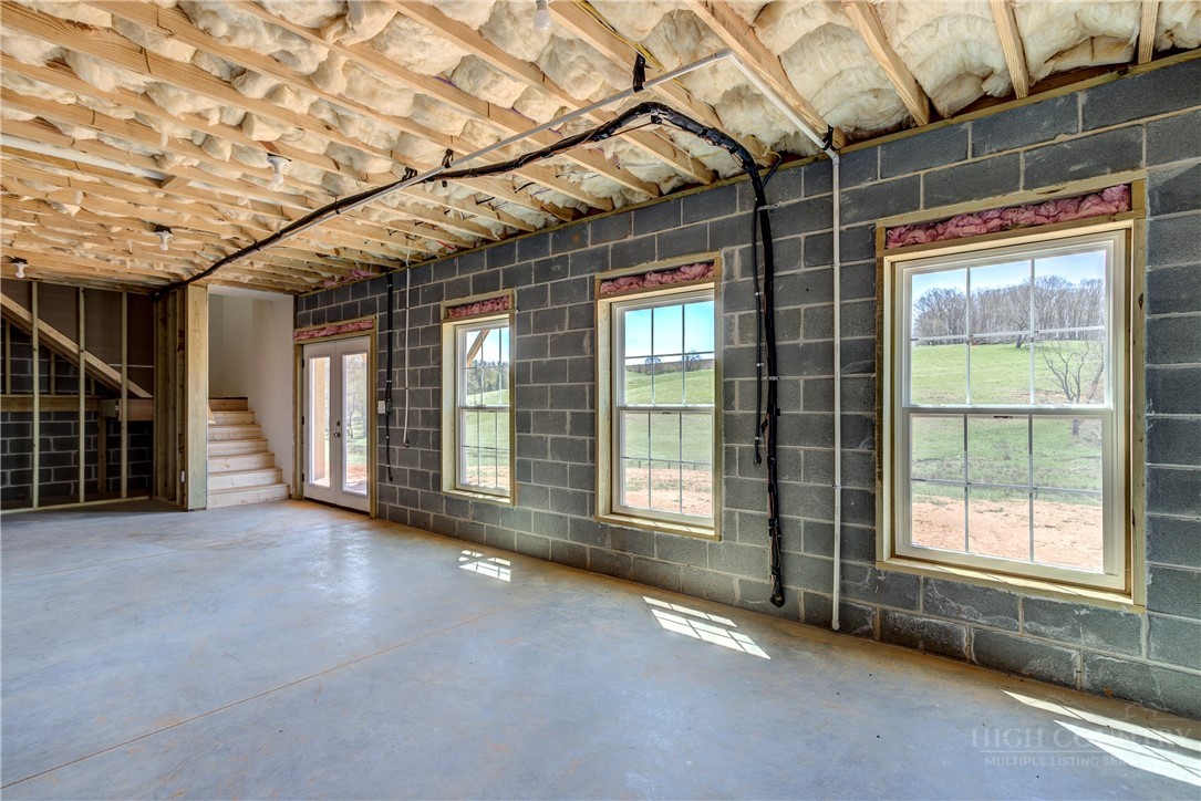 1052 Halsey Knob Road Sparta, NC 28675 - Photo 27 of 28 a view of an empty room with a balcony