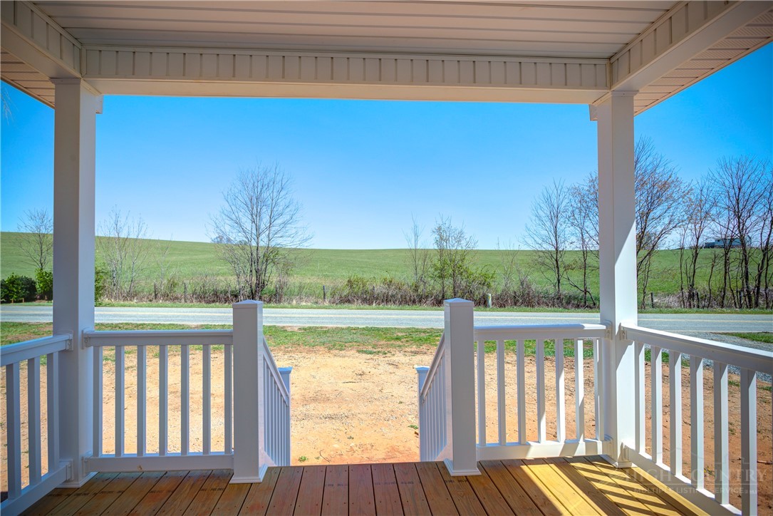 1052 Halsey Knob Road Sparta, NC 28675 - Photo 3 of 28 a view of balcony with wooden floor and fence