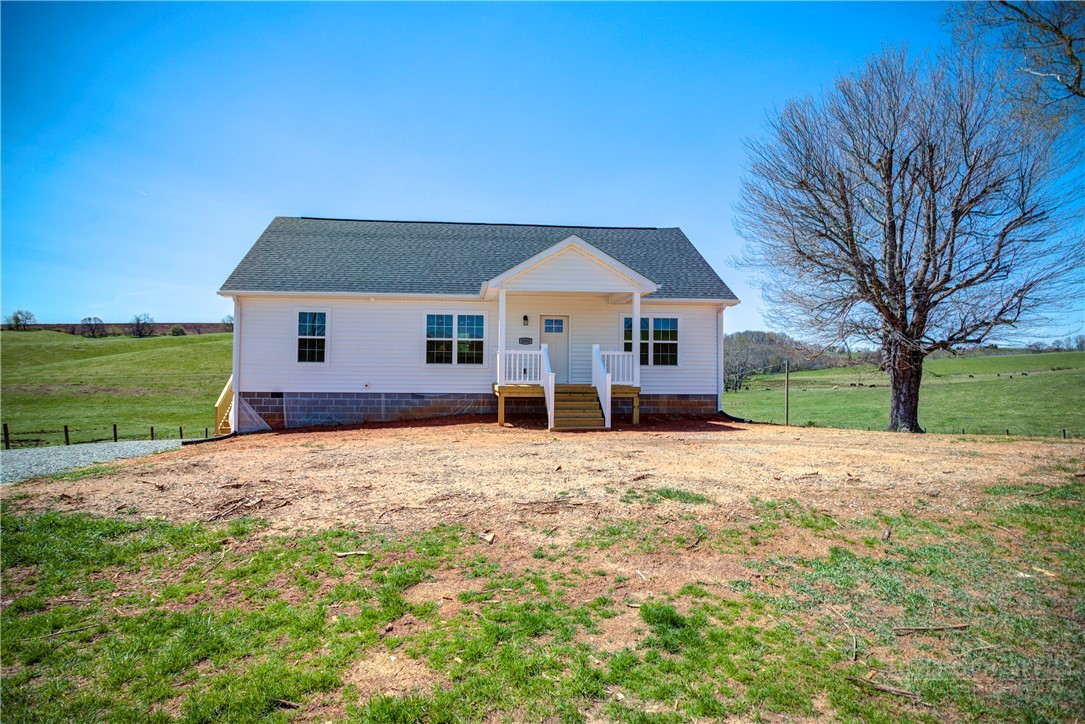 1052 Halsey Knob Road Sparta, NC 28675 - Photo 4 of 28 a front view of a house with a yard