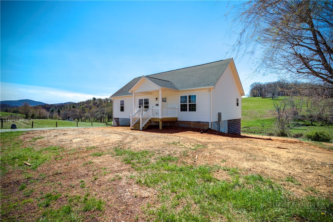 1052 Halsey Knob Road Sparta, NC 28675 - Photo 6 of 28 a view of a house with a yard
