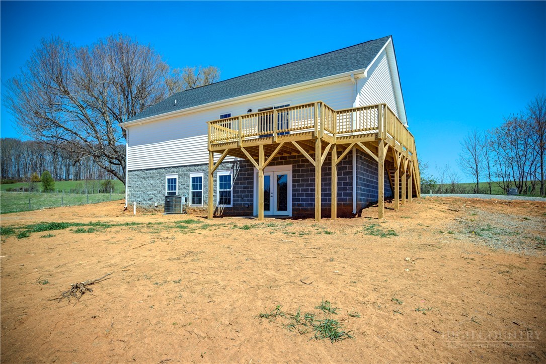 1052 Halsey Knob Road Sparta, NC 28675 - Photo 7 of 28 a view of a house with a yard and pathway