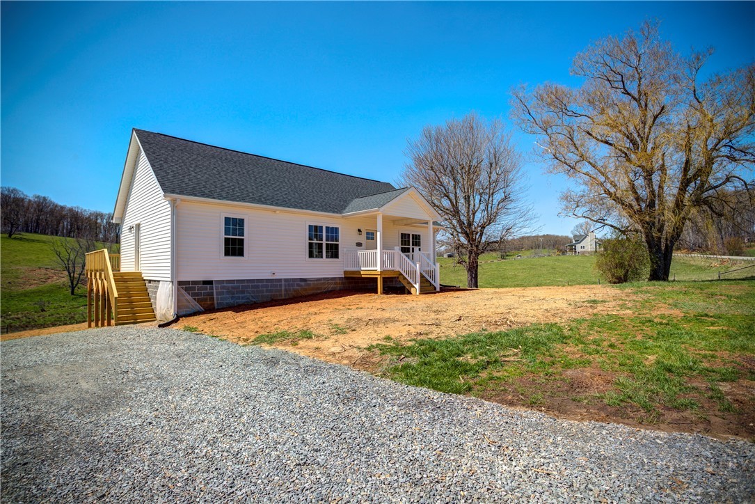 1052 Halsey Knob Road Sparta, NC 28675 - Photo 9 of 28 a house with yard in front of it