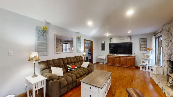 a living room with furniture and a flat screen tv