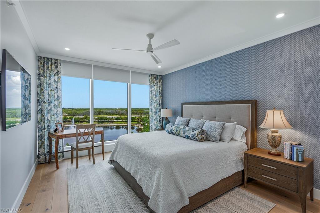 13925 Old Coast Road, Unit 905 Naples, FL 34110 - Photo 14 of 48 a bedroom with a bed and a large window