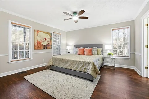 a bedroom with a large bed and a window
