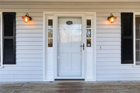 a view of front door and utility room