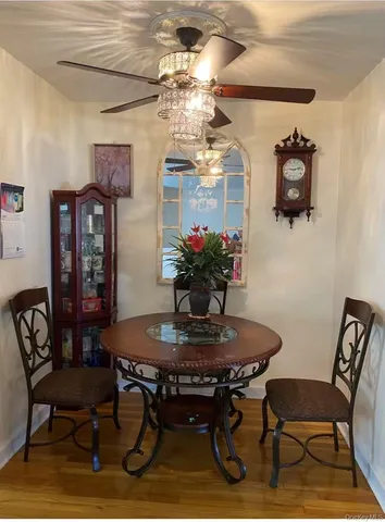 a dining room with furniture and window