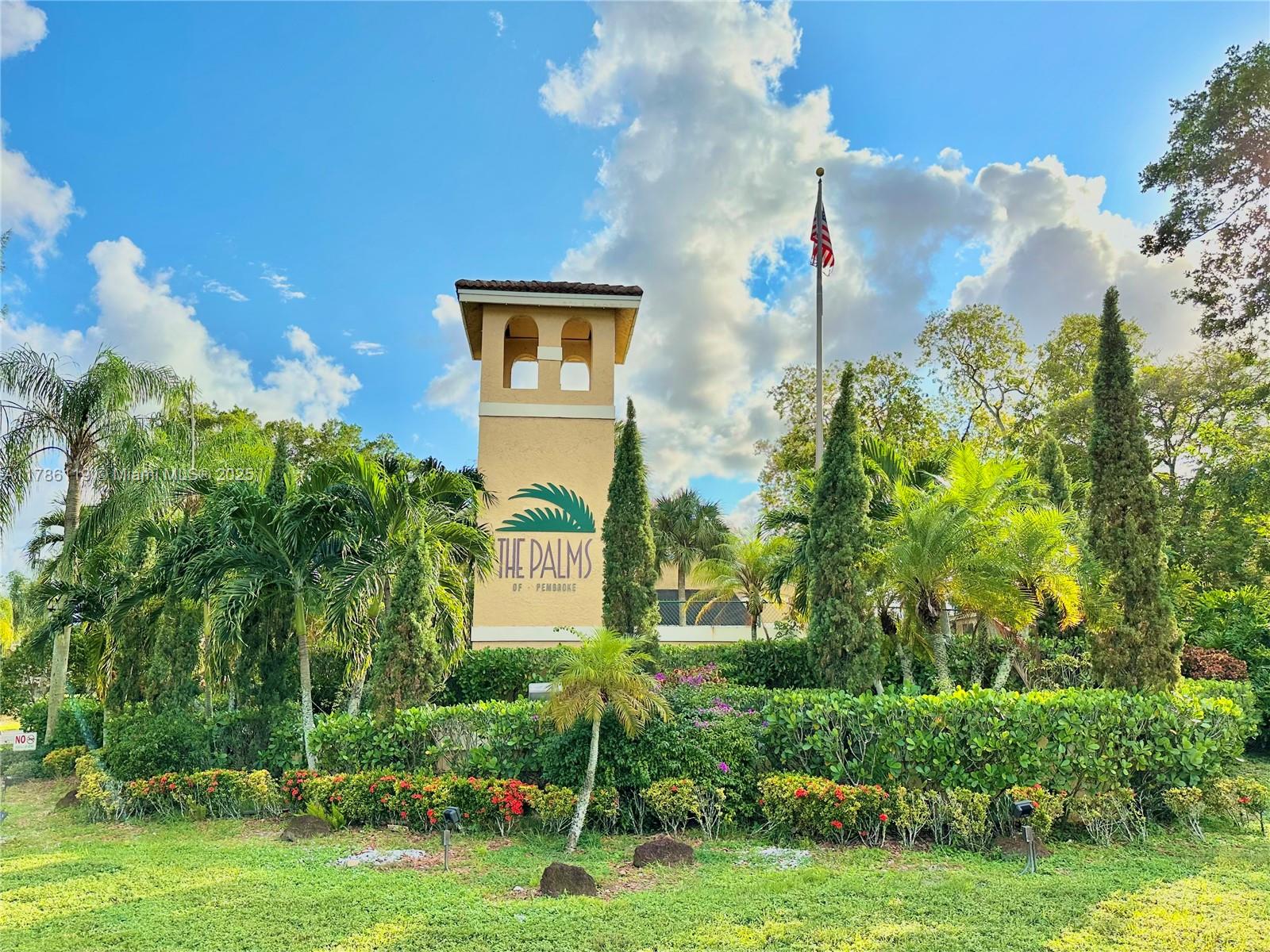 251 Palm Circle West, Unit 202 Pembroke Pines, FL 33025 - Photo 1 of 34 a front view of a house with garden