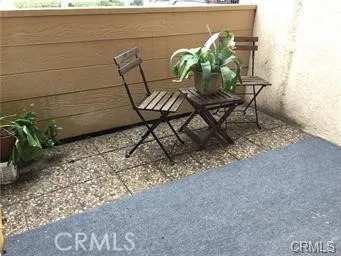 a view of a chairs and table on the wooden floor