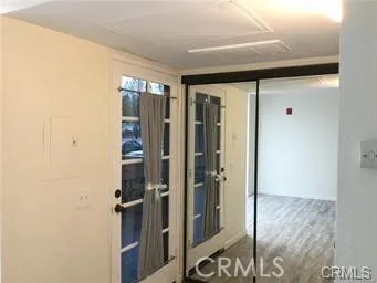 a bathroom with a shower and a glass door