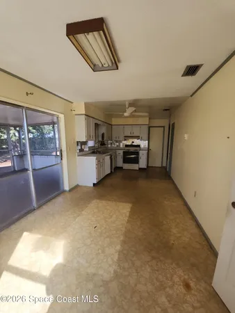 a view of a livingroom with furniture and windows