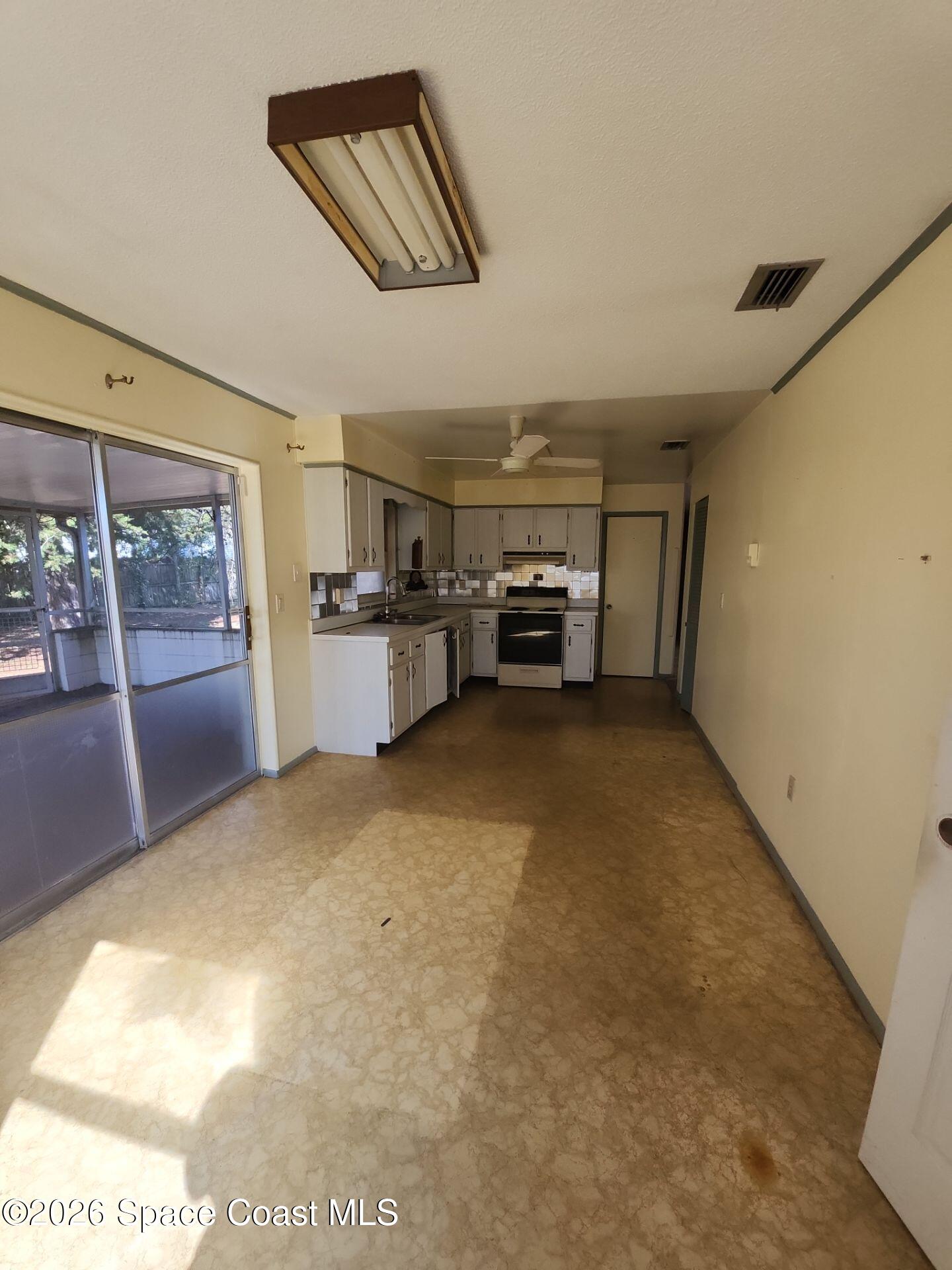 1654 Rice Avenue Titusville, FL 32796 - Photo 4 of 18 a view of a livingroom with furniture and windows