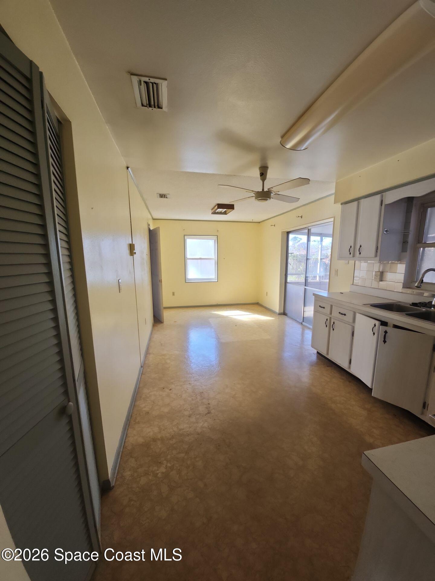 1654 Rice Avenue Titusville, FL 32796 - Photo 5 of 18 a view of a hallway to rooms and stairs