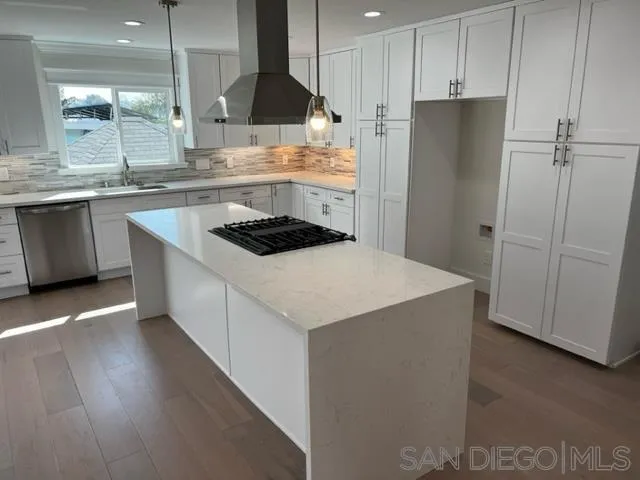 2687 Littleton Road El Cajon, CA 92020 - Photo 3 of 11 a kitchen with a sink a refrigerator and cabinets