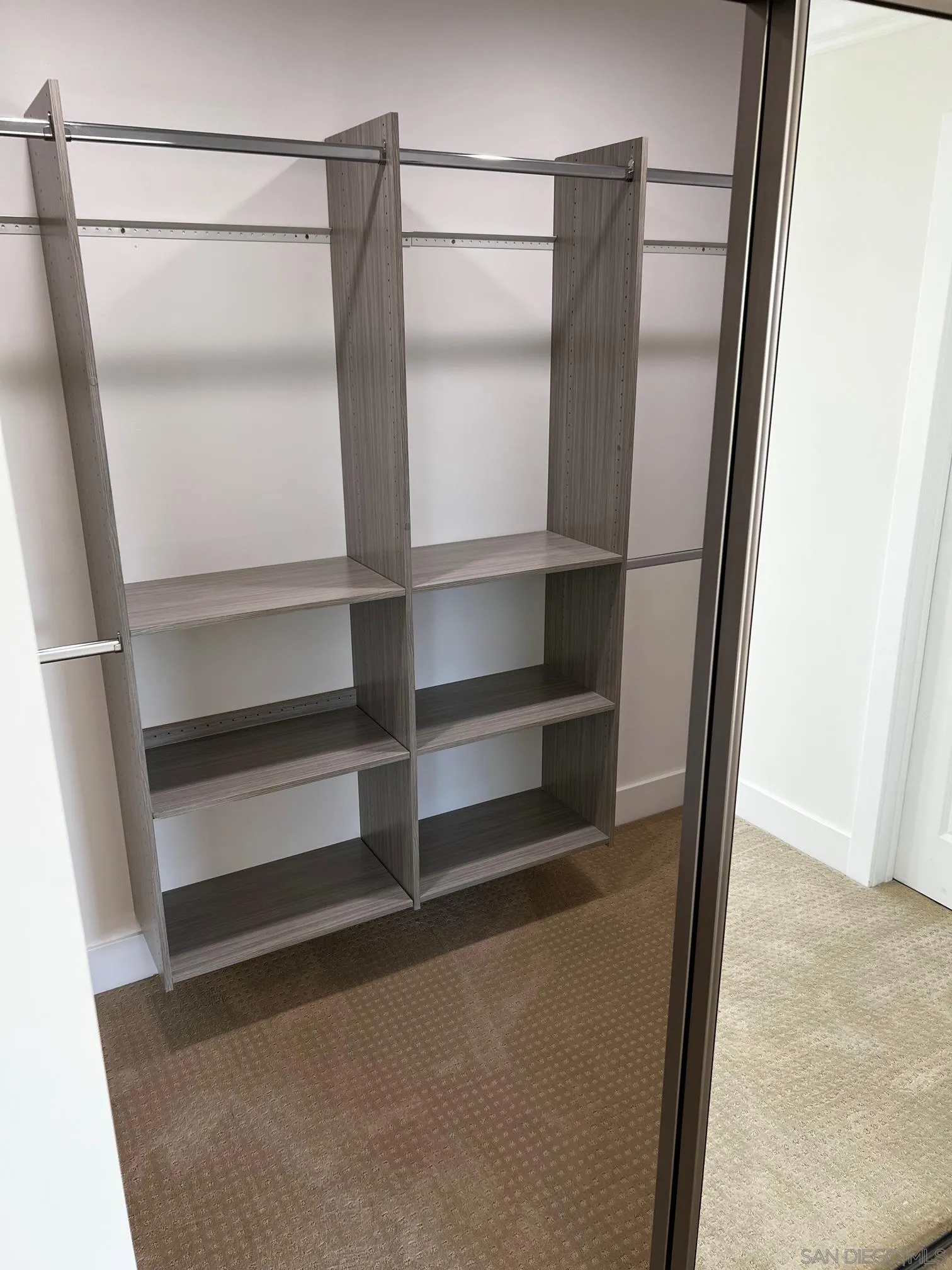 2687 Littleton Road El Cajon, CA 92020 - Photo 7 of 11 a view of walk in closet with empty racks