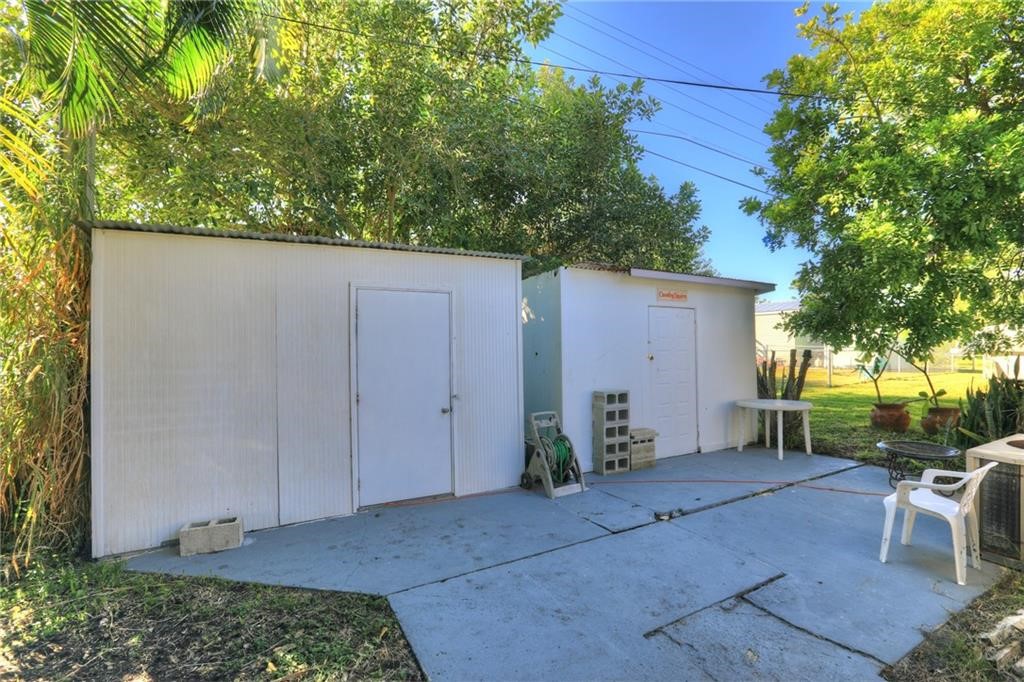 Undisclosed Address Sebastian, FL 32958 - Photo 4 of 6 a backyard of a house with table and chairs