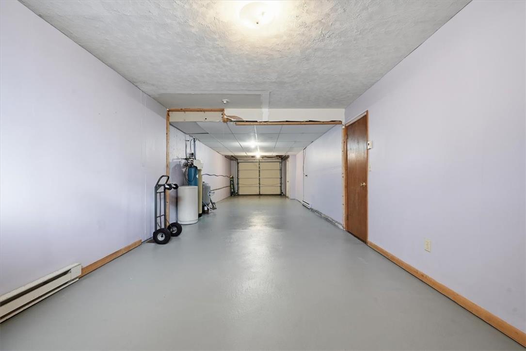 74 Swiss View Road Lehighton, PA 18235 - Photo 49 of 59 An expansive basement garage offers clean painted floors and direct interior access.