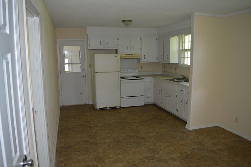 312 Copeland Road Clarksville, TN 37042 - Photo 4 of 10 a kitchen with white cabinets and sink