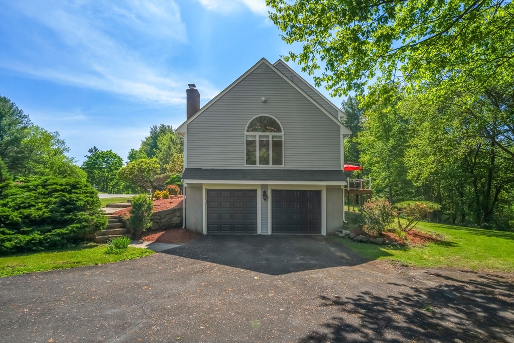 11 Cow Hill Road Sharon, MA 02067 - Photo 30 of 30 a front view of a house with a yard and garage