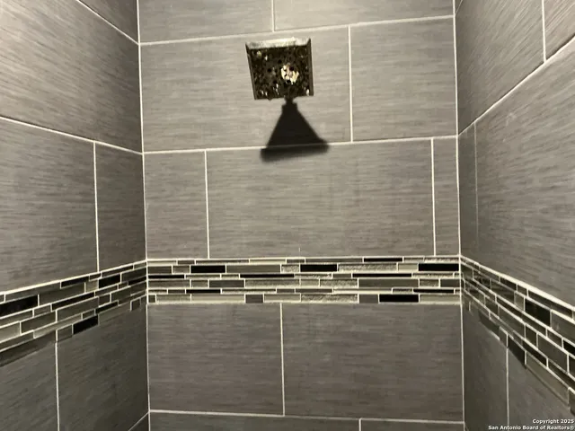 a bathroom with a sink a toilet and a window