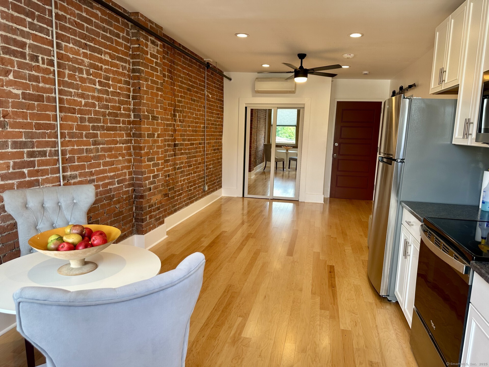 a bathroom with a sink mirror and shower