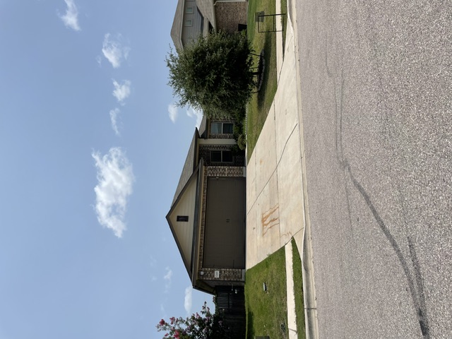 12401 Amber Lynn Path Manor, TX 78653 - Photo 1 of 33 A classic brick and siding residence with an integrated garage, set back from the street.