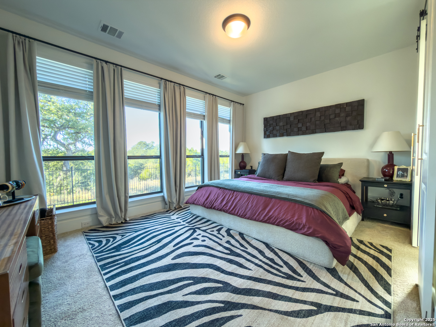 416 Kimble Creek Loop Kyle, TX 78640 - Photo 15 of 29 a bedroom with a large bed and a large window