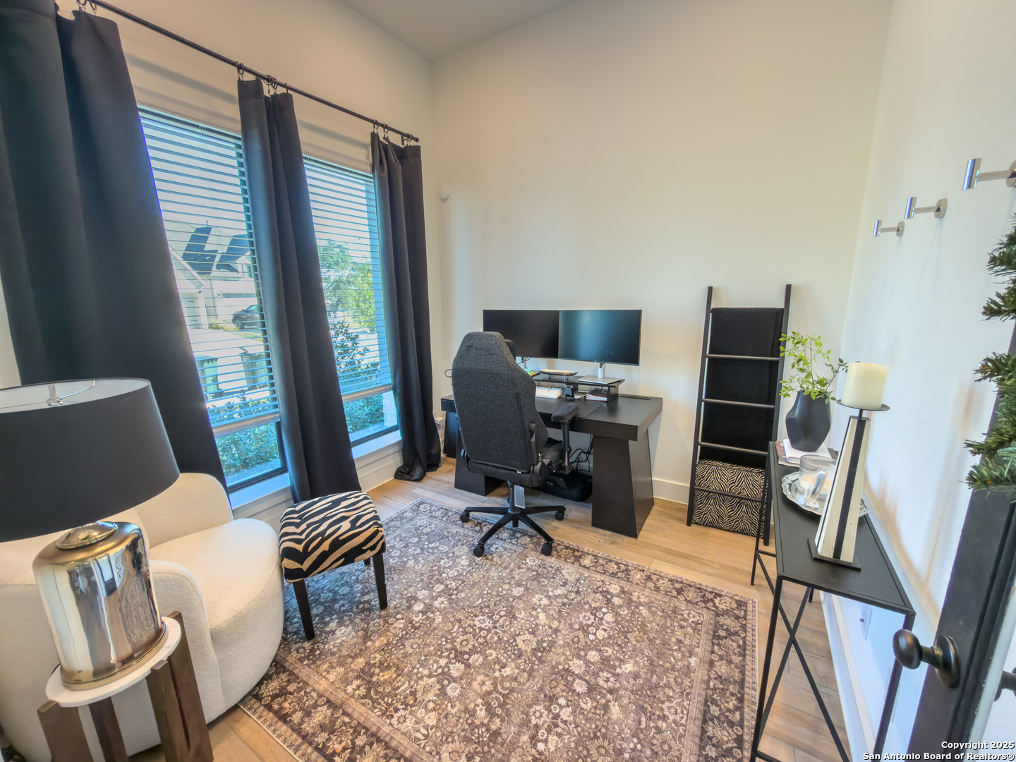 416 Kimble Creek Loop Kyle, TX 78640 - Photo 6 of 29 a view of a workspace with furniture and a window