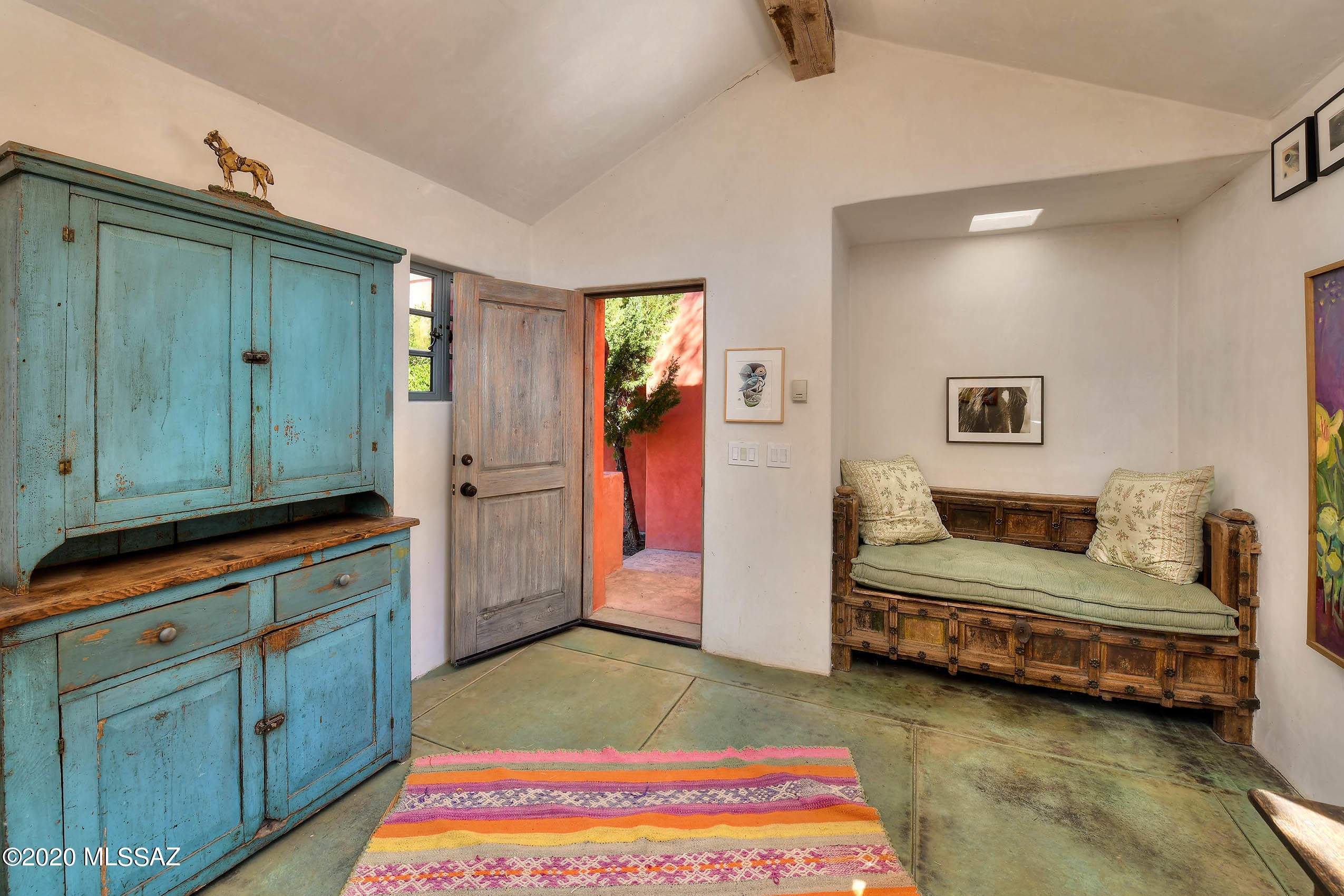 360 Harshaw Creek Road Patagonia, AZ 85624 - Photo 30 of 50 a spacious bedroom with two beds and painted walls