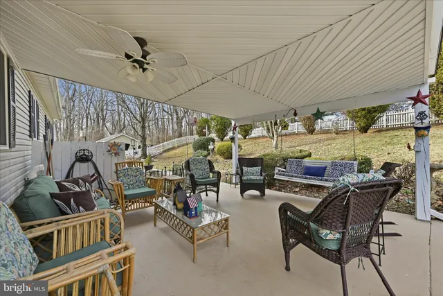 view of a house with swimming pool and sitting area